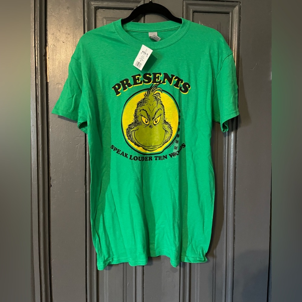 Graphic tee with The Grinch. New with tags .